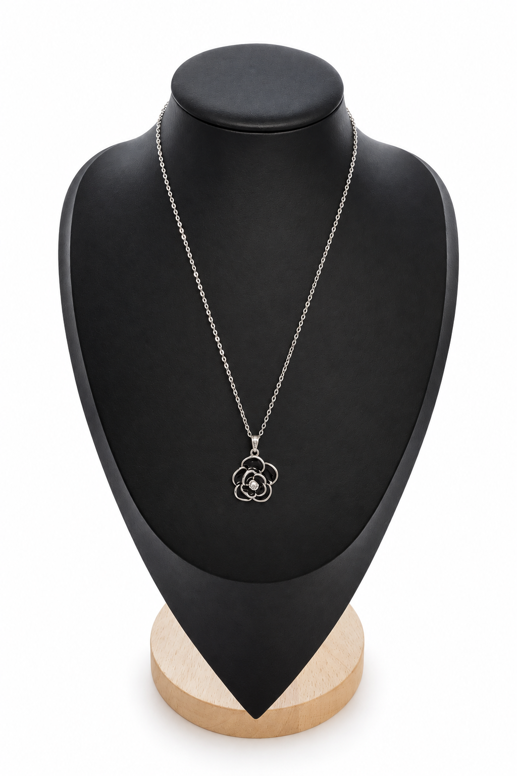 Necklace on its display stand with a plain white background