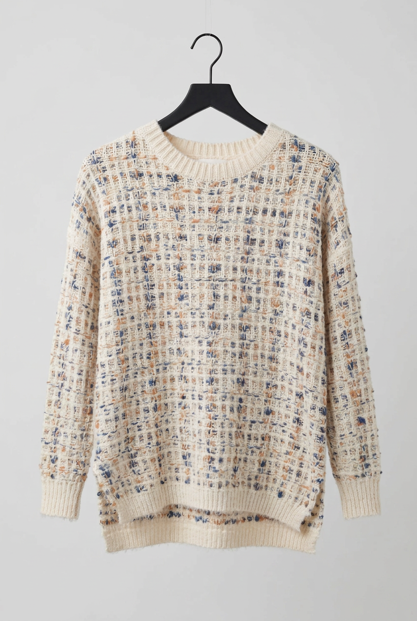 Sweater against a plain background