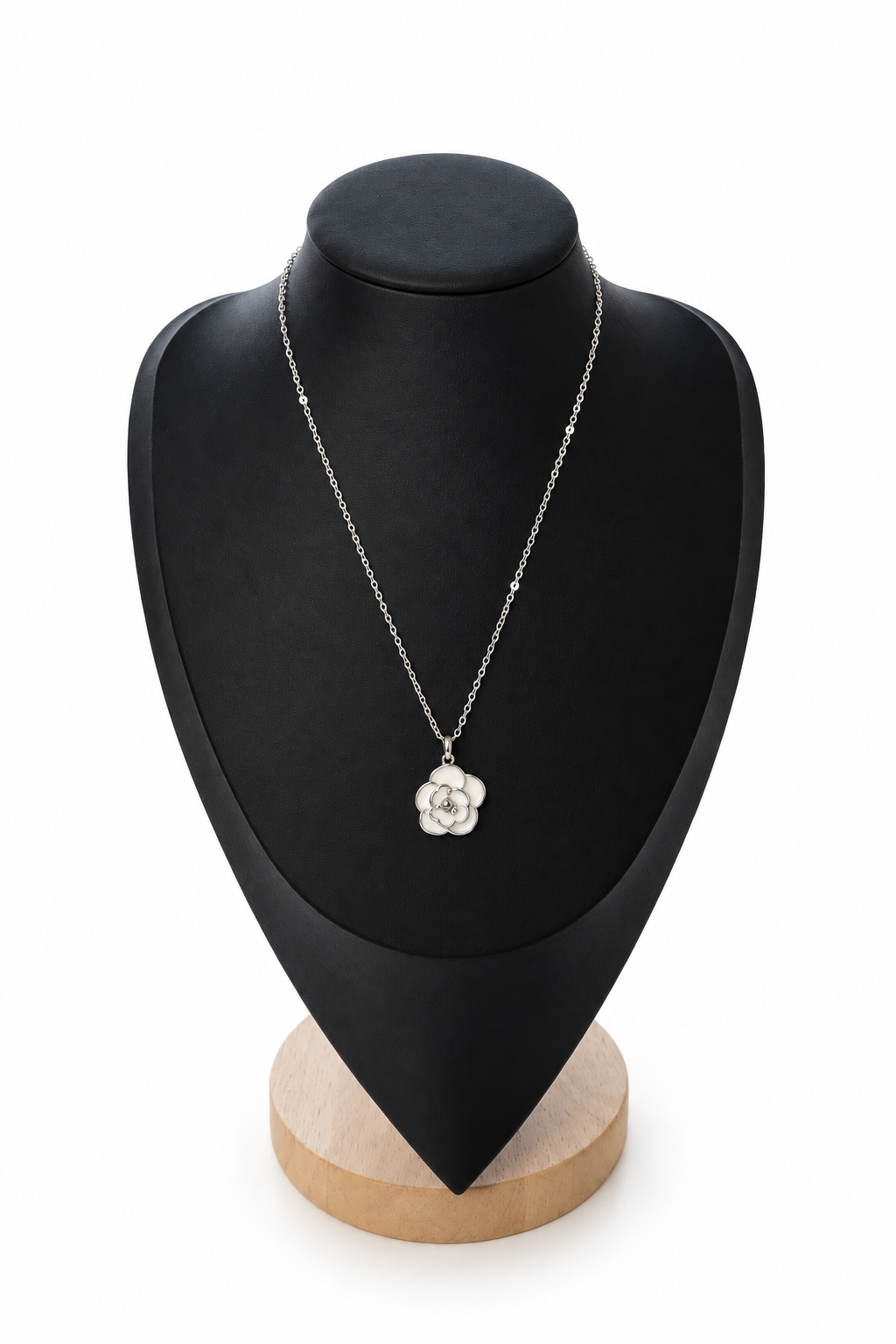 White floral pendant necklace on a plain white background